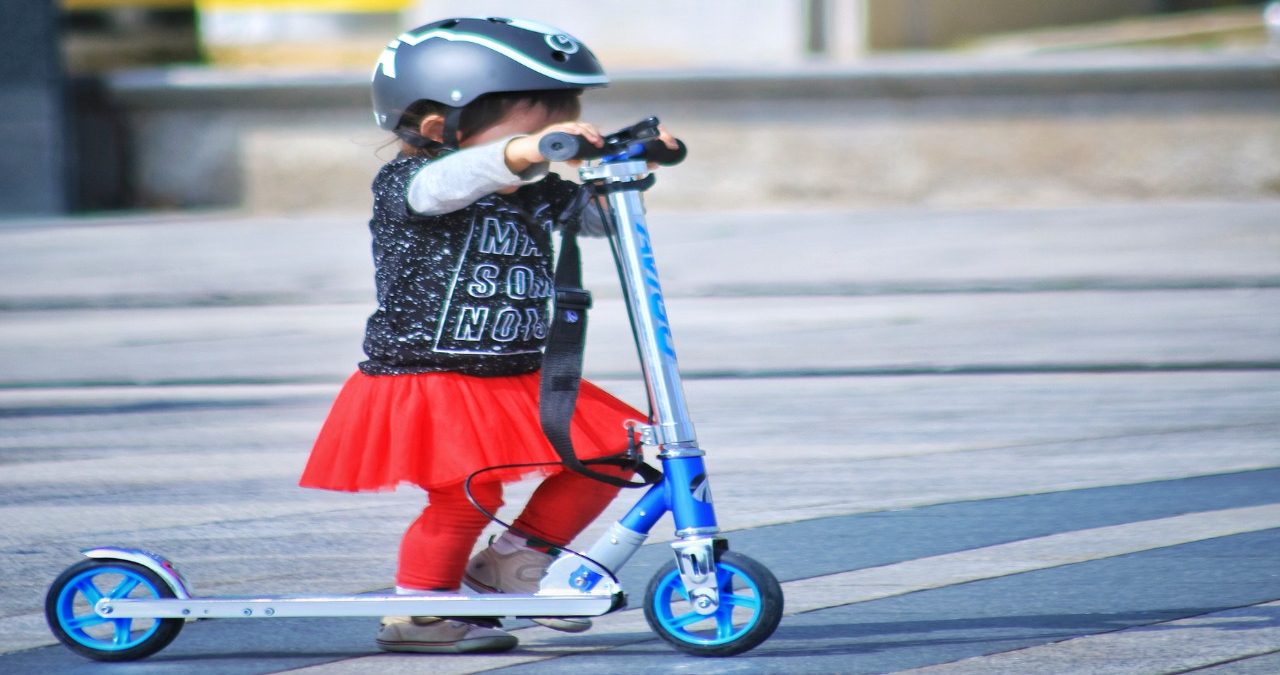 toddler-using-scooter-on-road-1642055-1-1.jpg